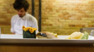 naked fish japanese bistro uni nigiri on sushi bar counter