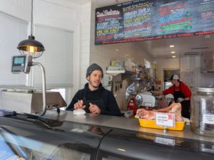 Philip Grubisa manning the counter at Beltex Meats