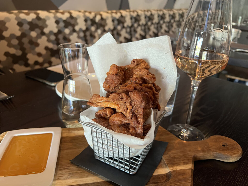 Carson Kitchen - chicken skins with smoked honey