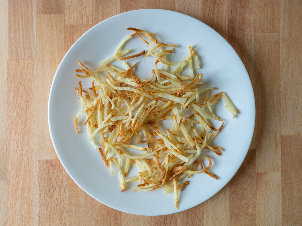 Air fried shoestring potatoes