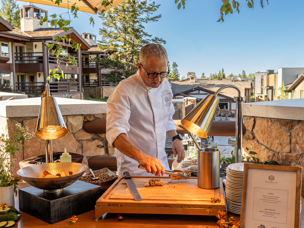 Chef Zane Holmquist working al fresco at Stein Eriiksen Lodge